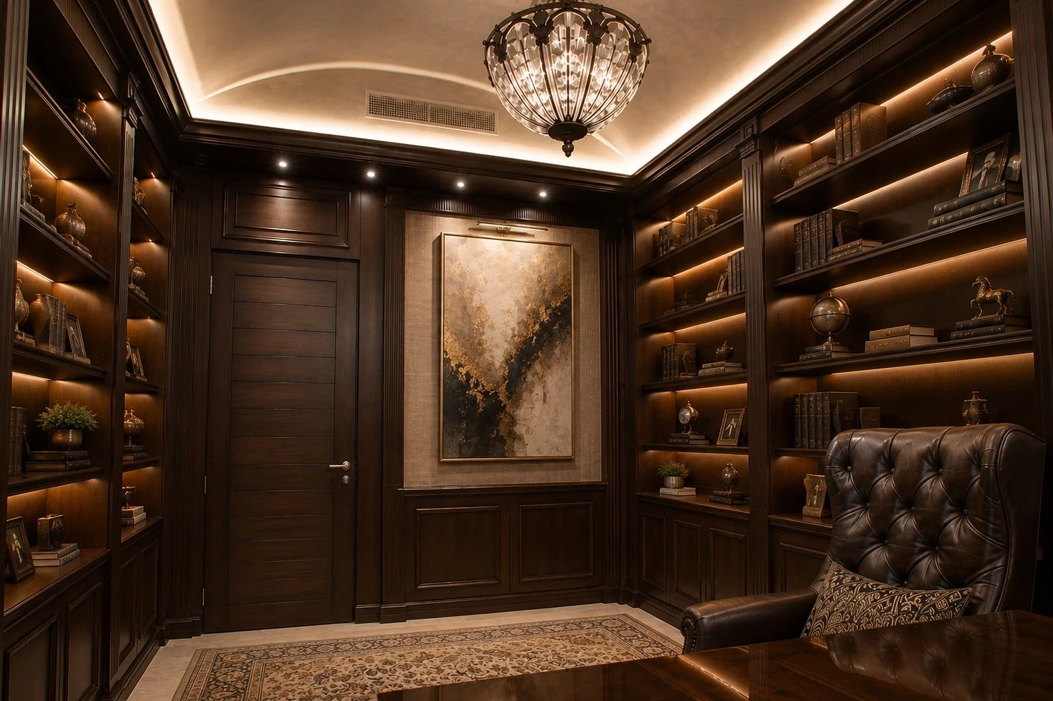 A dark wood study with illuminated bookshelves, a leather armchair and a chandelier